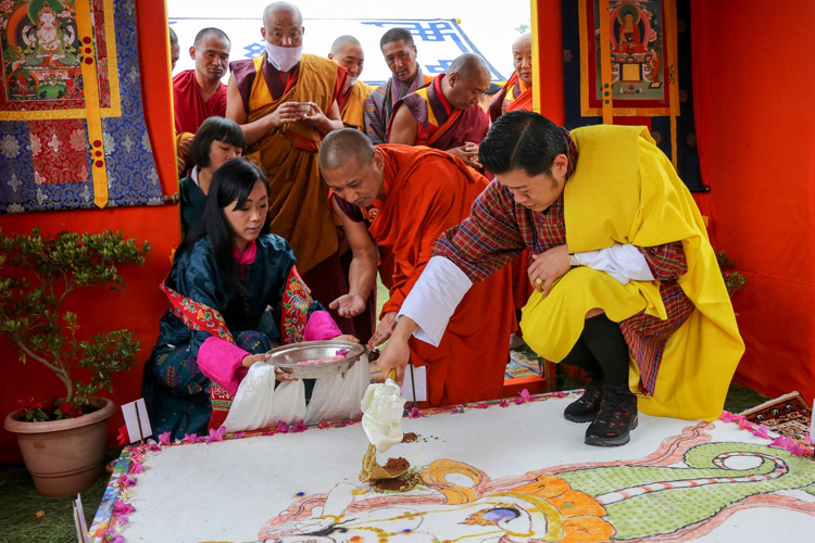 Bhutan's King taking part in a ground-breaking ceremony for the new law school
