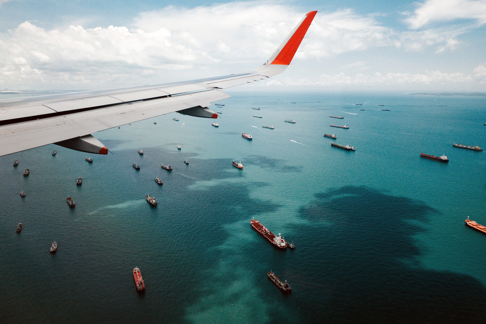 photo of container ships outside port of Singapore