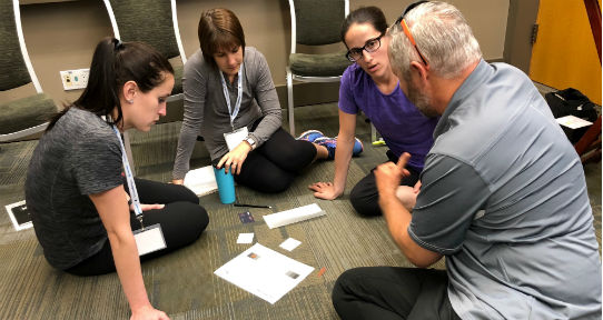 Teachers playing Factors (an interactive drug education game developed by CISUR) at the Physical and Health Education National Conference in Whistler BC