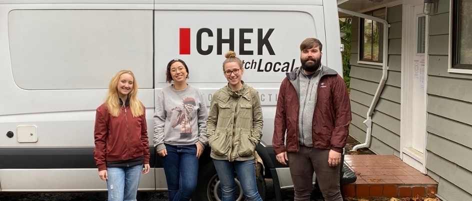 A group of young people standing outside a white news van with the CHEK News logo on the side. They are smiling at the camera.