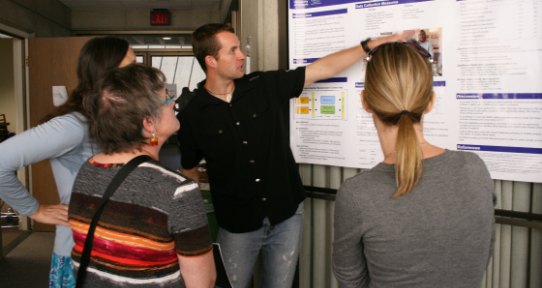 Student affiliate David presenting a research poster to an audience