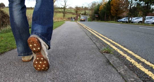 A person walking down the road. 