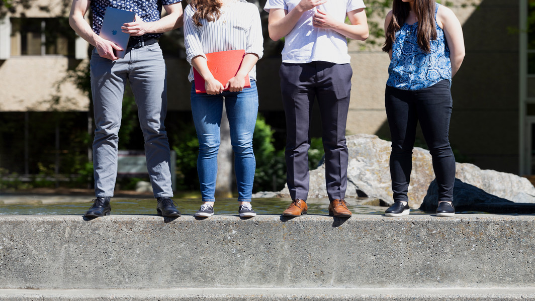 People standing in front of UVic.