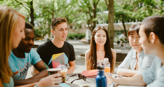 Group of UVic students sitting at a picnic table
