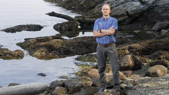 Profile photo of Adrian Marchetti by the ocean