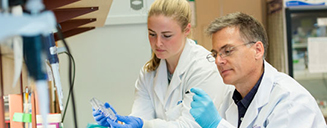 Professor and student working in a lab