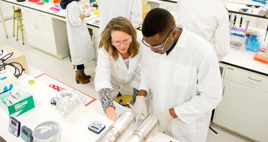 Student receiving help in a lab