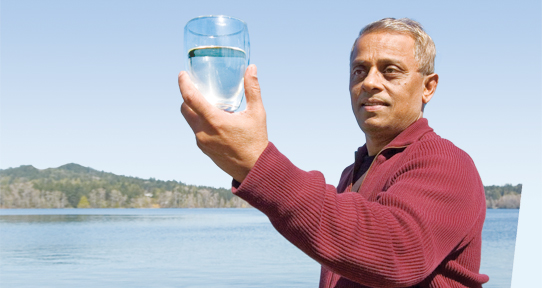 Mazumder examining water