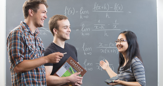 Students in front of a blackboard