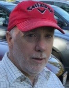 Headshot of Dr. Stephen Evans, wearing a red baseball cap.