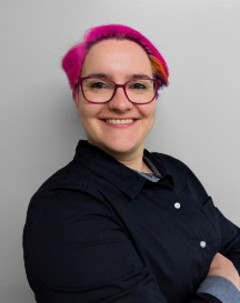 Smioling headshot of Dr. Mariya Goncheva on neutral grey background