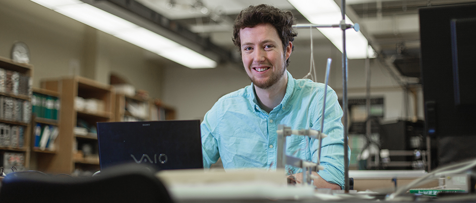 Student Daniel Crossley-Wing on a laptop in a UVic lab