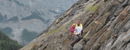Student conducting research on the side of a mountain