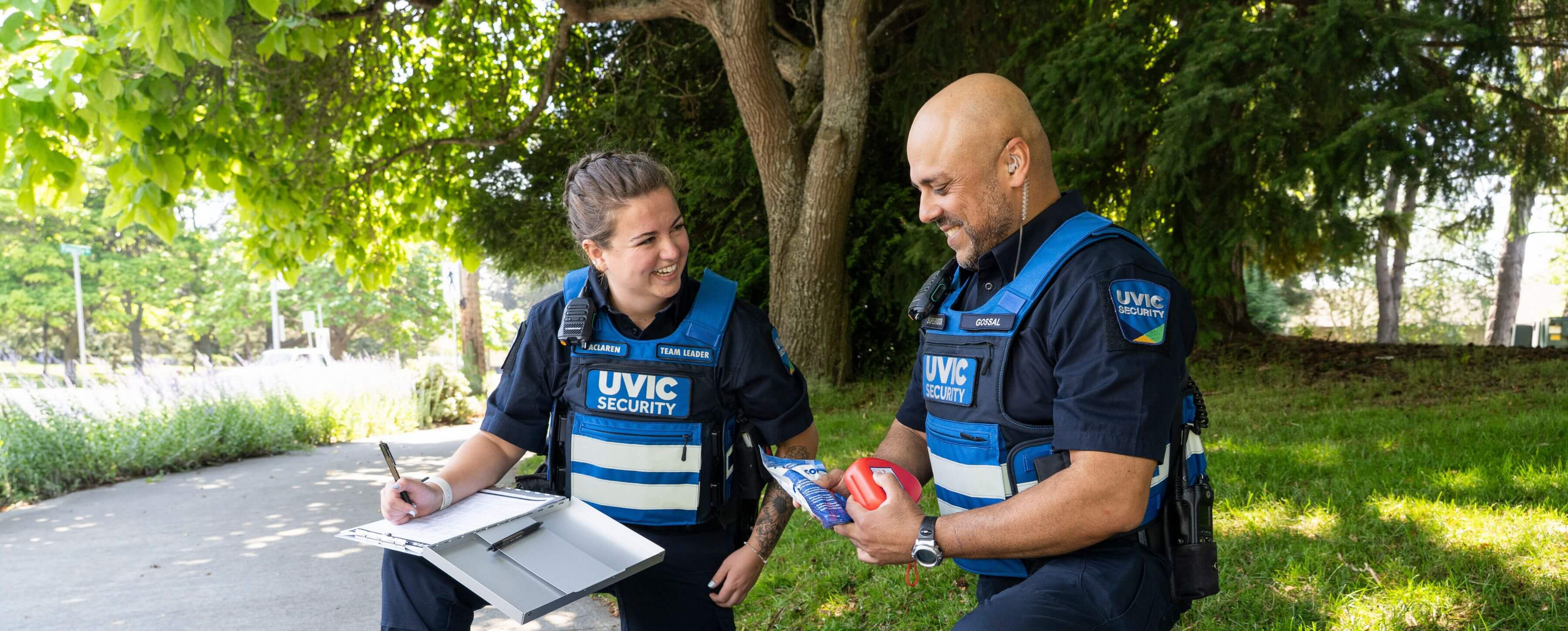 two UVic security officers with first aid supplies