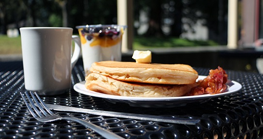 pancake breakfast with coffee and yogurt parfait