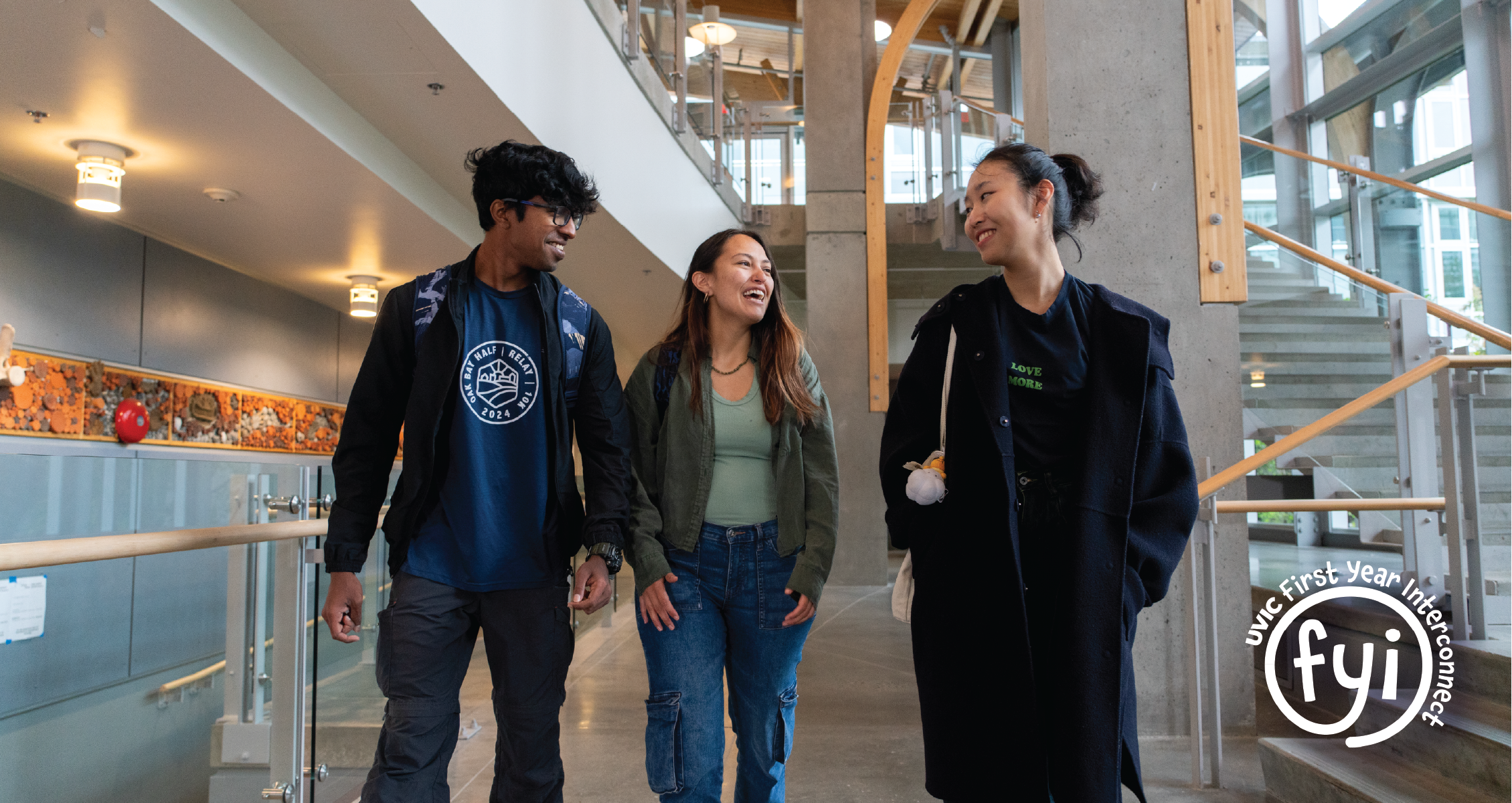 three students walking in a building