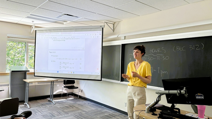 Economics PhD student embraces teaching December 02, 2025. Janet Burlacu, PhD economics student, teaching ECON 313, UVic. Credit: Isaac Earl.