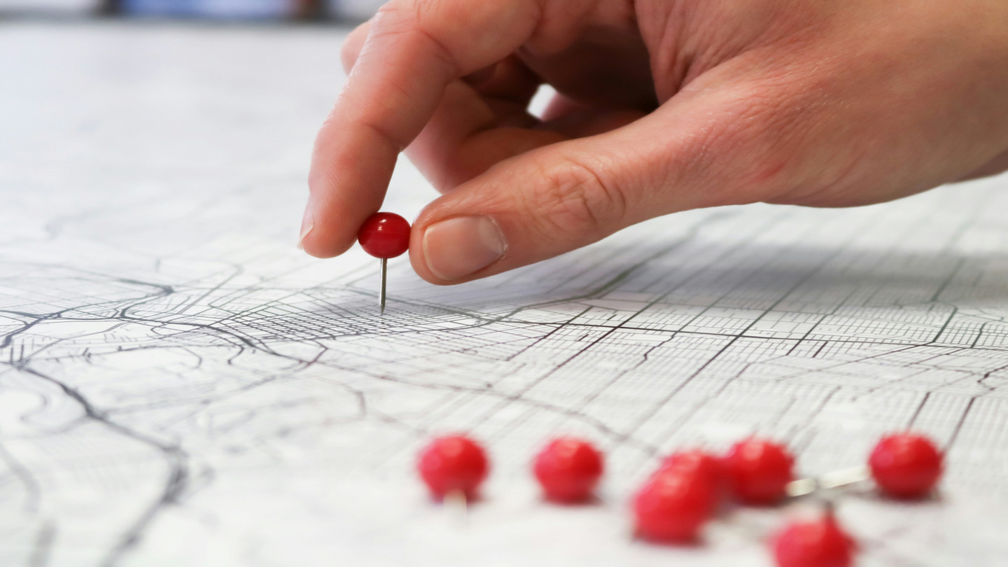 A map with several red pins 