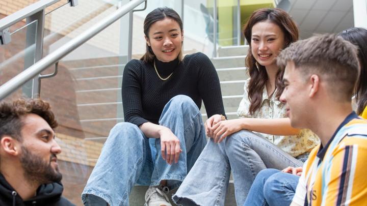 students sitting on steps