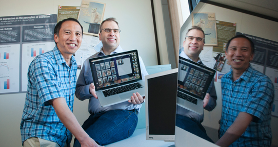 Tanaka and Sheppard with a computer showcasing their face recognition software