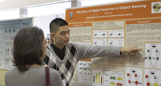 Terry Lin explains his poster on the role of motor features in object naming.