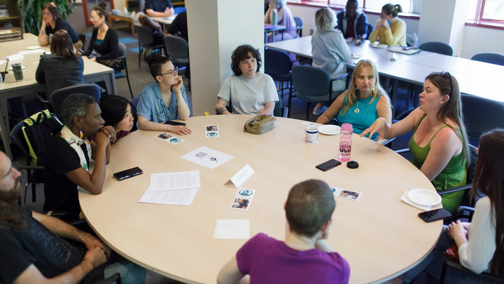Students working around a table