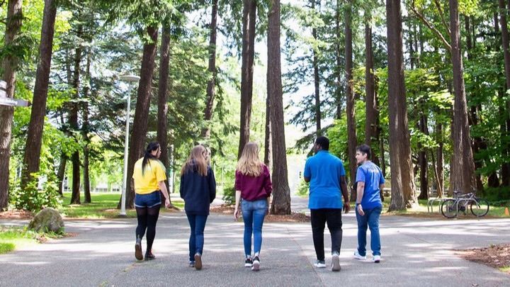 Students walking away from the camera on UVic campus