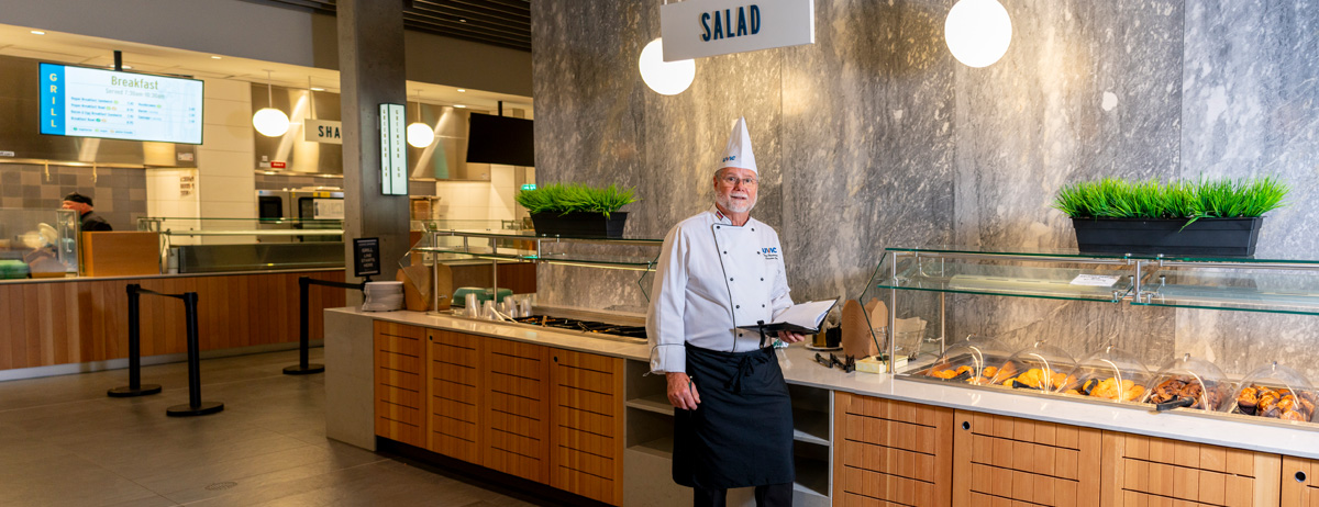 Tony heesterman in front of salad bar