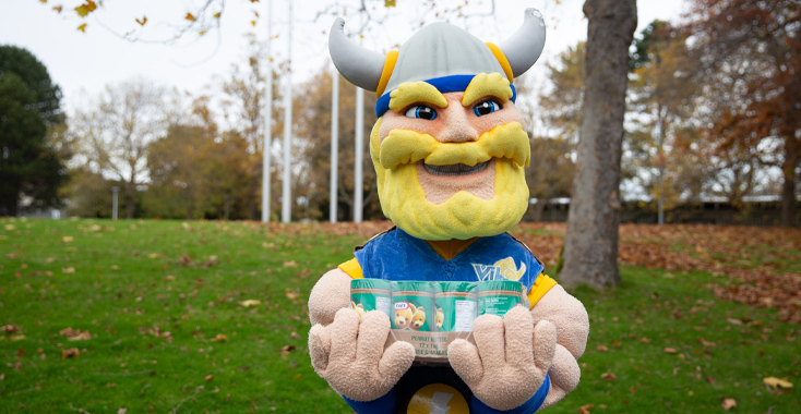 Thunder holds a case of peanut butter for Stocktober.
