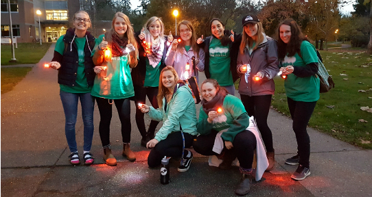 The Residence Green Team giving out bike lights during our annual "Lighten Up!" campaign