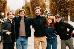 Focal team standing in a line smiling and mugging for the camera with a sense of camradry