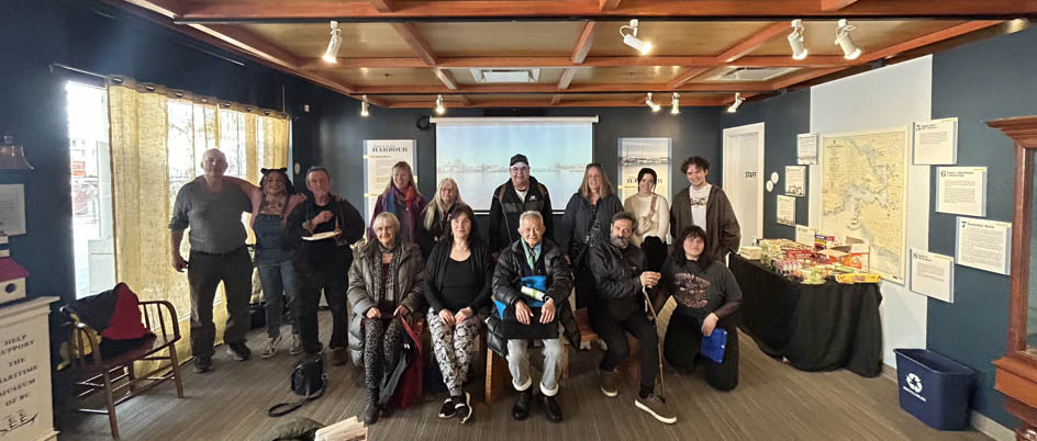 A group photo of students and staff in the Maritimes Museum of BC. This is one of the outings for 201 alumni students