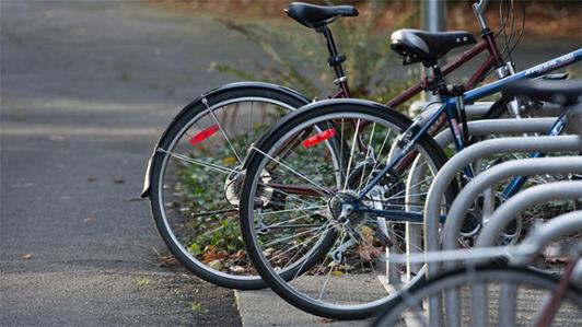 Several bicycles at a rack