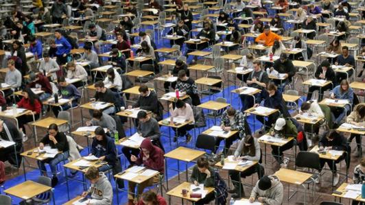 Students writing exams in the UVic gym