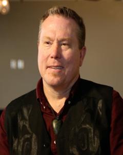 Jeff Corntassel wearing black embroidered vest