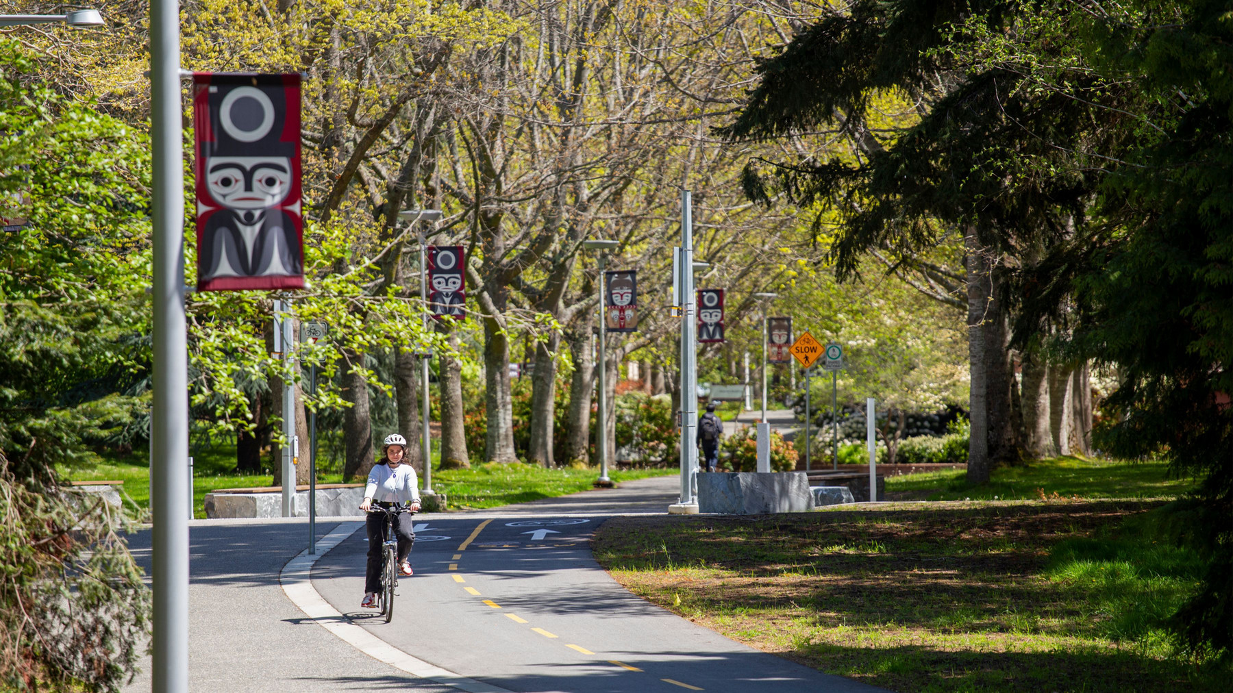 biker riding on a bicycle lane at UVic