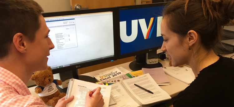 Two people working at a desk